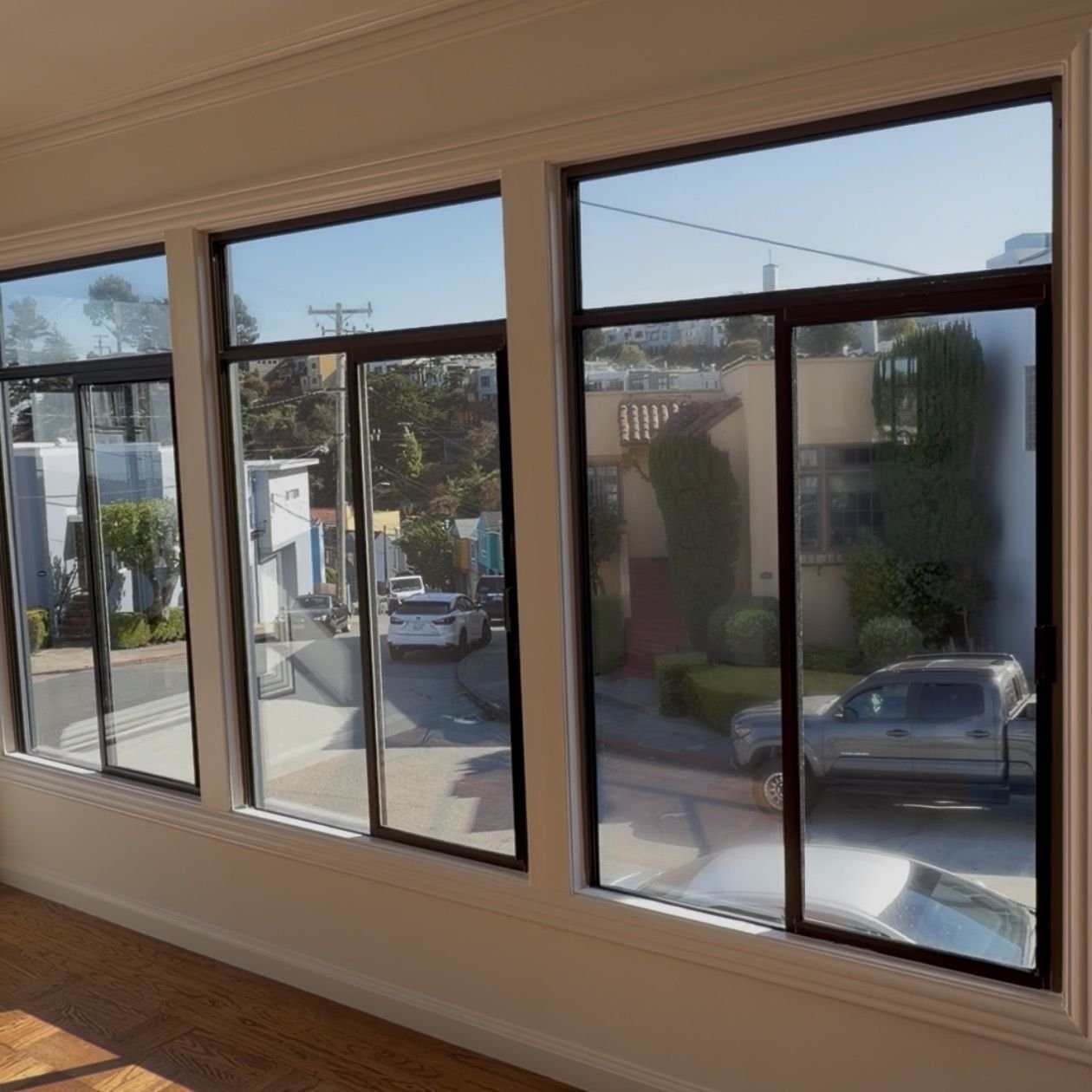 The same sunroom windows after cleaning, the right-hand window now crisp and clear