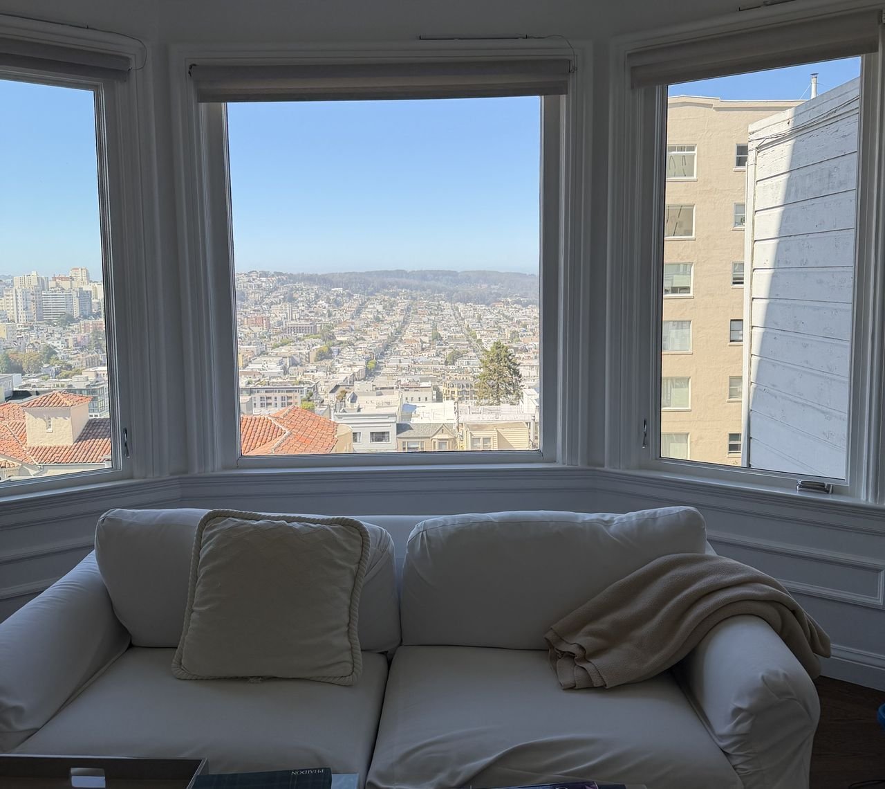A San Francisco bay window with freshly cleaned glass looking out over the city