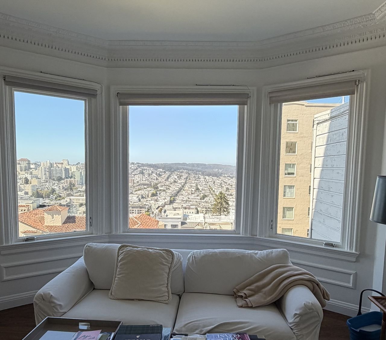 A bay window in a San Francisco home with a clear view over the city